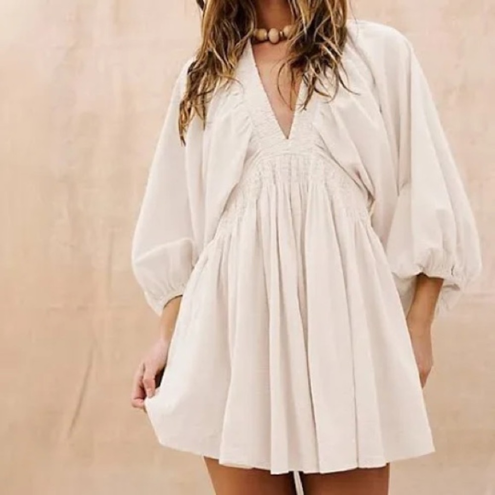 Olivaceous White puffy long sleeve dress with deep plunge vneck in front
